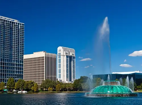 Lake Eola fountain and downtown Orlando, FL