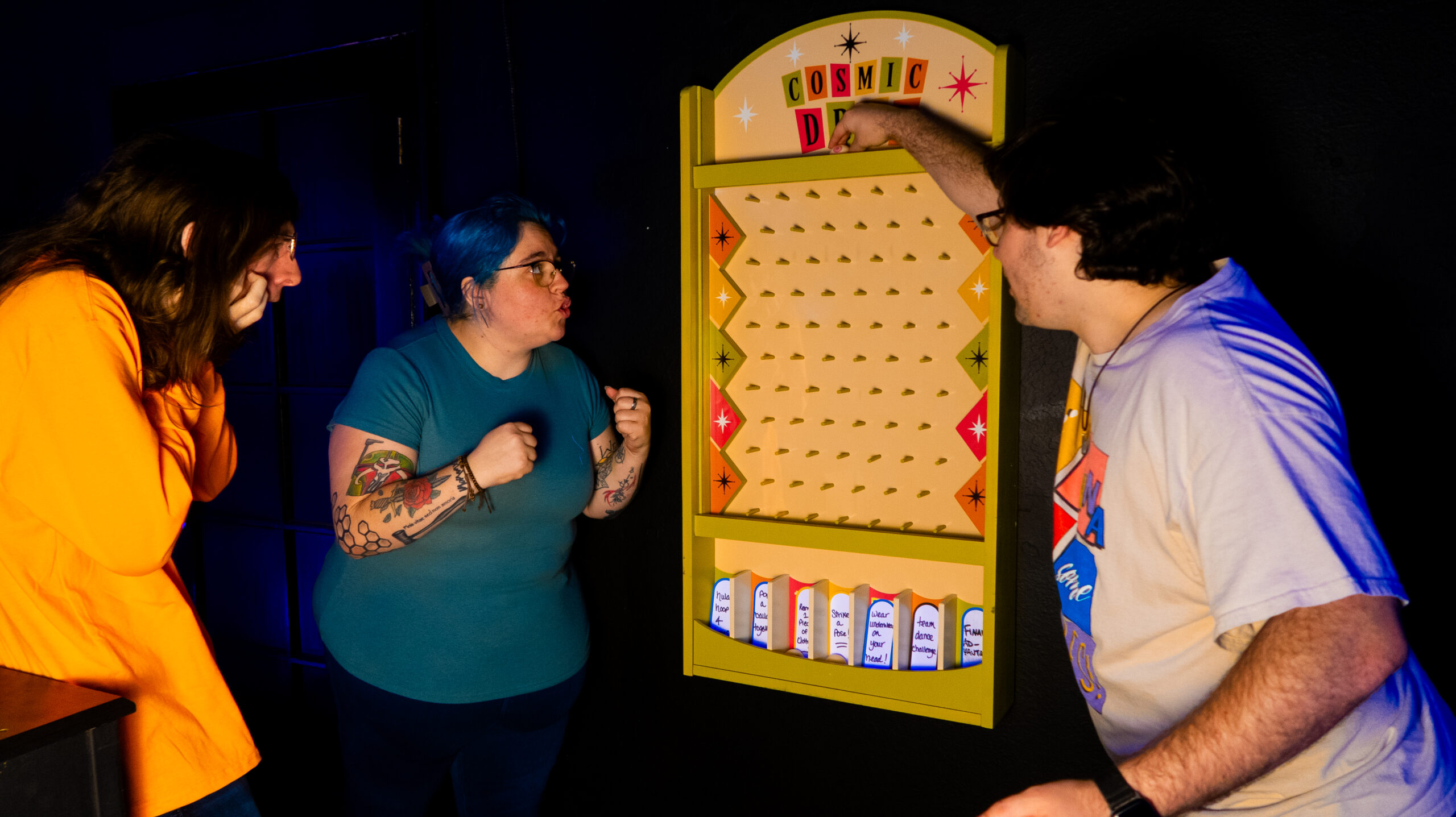 Players at the Cosmic Drop board